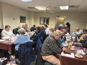 Guild members working on an educational exercise at December 2025 meeting.
